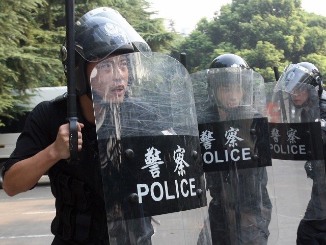 Chinese riot policemen practice in a park close to Shanghai Stadium, September 12, 2007, i