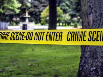 Crime scene tape in a city park