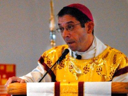 Bishop of the Diocese of Brownsville, Daniel E. Flores conducts the funeral mass for Immig