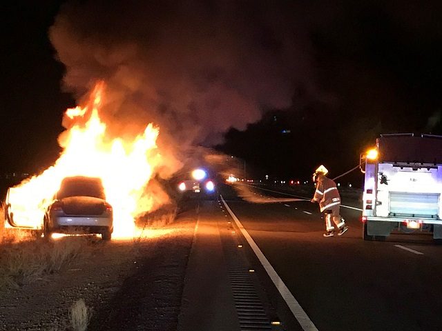 Border Patrol agents rescue two migrants from human smuggler's burning car. (U.S. Border Patrol/Tucson Sector)