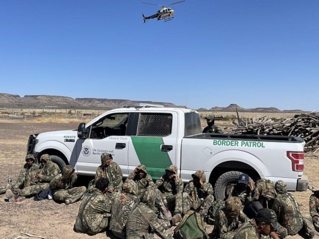 A Texas DPS helicopter crew guides Border Patrol agents in the Big Bend Sector to a group
