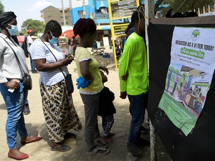 Officials from the Independent Electoral and Boundaries Commission (IEBC), register new voters during the ongoing voters registration in preparation for the 2022 Kenyan general election, on February 04, 2022 in Nairobi (Photo by Simon MAINA / AFP) (Photo by SIMON MAINA/AFP via Getty Images)