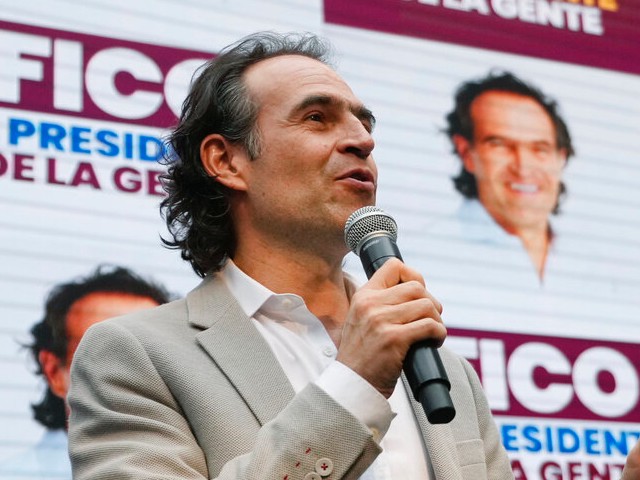 Presidential candidate Federico Gutierrez speaks after he and his running-mate Rodrigo Lara registered their ticket at the National Registry in Bogota, Colombia, Monday, March 28, 2022, ahead of May 29 elections. (AP Photo/Fernando Vergara)