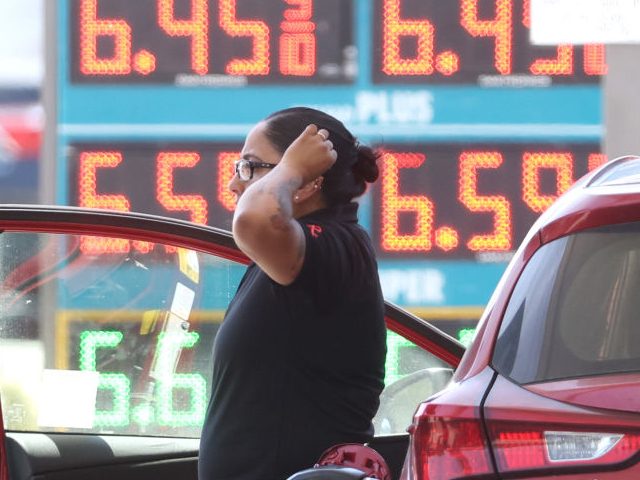 PETALUMA, CALIFORNIA - MAY 18: A customer pumps gas into their car at a gas station on May