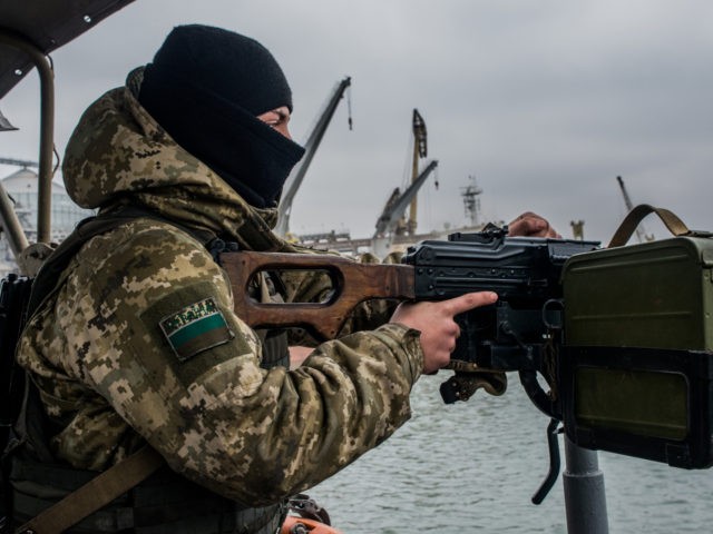 MARIUPOL, UKRAINE - NOVEMBER 28: A Ukrainian sea border security force soldier mans the machine-gun of a vessel on the Azov Sea on November 28, 2018 in Mariupol, Ukraine. Ukrainain President Poroshenko has declared martial law in response to the attacking and seizing of three Ukrainian naval vessels by Russian …