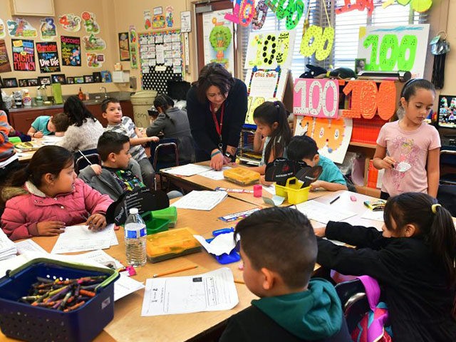 Telfair Elementary School first grade teacher Ms. Gutierrez works with her students on Feb