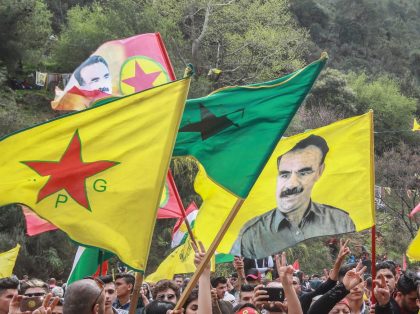 Members of the Lebanese Kurdish community wave the flags of (L to R) the Kurdish People's Protection Units (YPG), Women's Protection Units (YPJ), another showing jailed Kurdish militant leader Abdullah Ocalan, and the flag of the Kurdistan Workers' Party (PKK), during a celebration marking the spring festival of Nowruz (Noruz) …