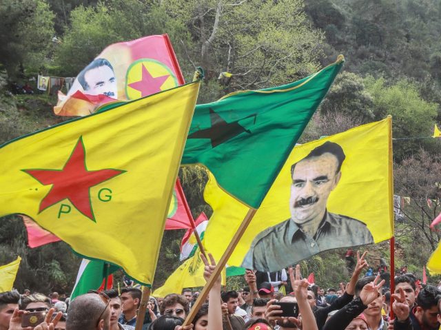 Members of the Lebanese Kurdish community wave the flags of (L to R) the Kurdish People&#0