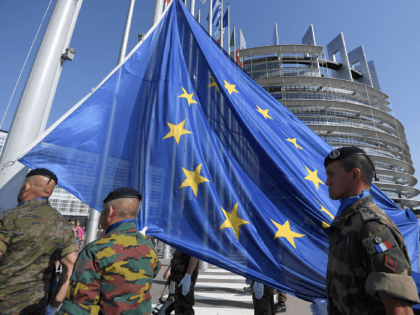 Soldiers of Eurocorps raise an European Union flag during the flag-raising ceremony on the eve of the inaugural session of new European Parliament on July 1, 2019 in front of Louise Weiss building (R), headquarters of the European Parliament in Strasbourg, eastern France. (Photo by FREDERICK FLORIN / AFP) (Photo …