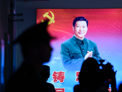 A portrait of China's President Xi Jinping is seen during a tour arranged for the media by the press centre in charge of celebrating the 70th anniversary of the country's founding, at a camp on the outskirts of Beijing on September 25, 2019. - China marks 70 years of Communist …