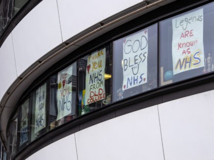 LONDON, UNITED KINGDOM - APRIL 02: Signs with messages of support to the NHS staff are displayed in windows of a building near St Thomas' Hospital on April 02, 2020 in London, England. The Coronavirus (COVID-19) pandemic has spread to many countries across the world, claiming over 40,000 lives and …