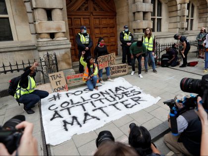 Participants gather for a protest called by the Rhodes Must Fall campaign calling for the removal of the statue of British imperialist Cecil John Rhodes outside Oriel College, at the University of Oxford on June 9, 2020. - Following the toppling of slave trader Edward Colston during a Black Lives …
