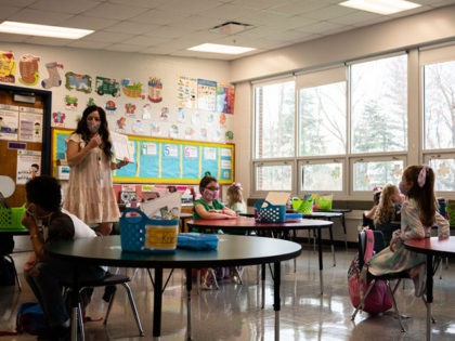 LOUISVILLE, KY - MARCH 17: Students and teachers participate in a socially distanced classroom session at Medora Elementary School on March 17, 2021 in Louisville, Kentucky. Today marks the reopening of Jefferson County Public Schools for in-person learning with new COVID-19 procedures in place. (Photo by Jon Cherry/Getty Images)