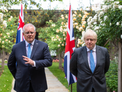 LONDON, ENGLAND - JUNE 15: UK Prime Minister Boris Johnson (R) and Australian Prime Minister Scott Morrison in the garden of 10 Downing Street, after agreeing the broad terms of a free trade deal between the UK and Australia, on June 15, 2021 in London, England. The leaders met as …