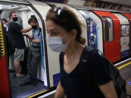 LONDON, ENGLAND - JULY 19: Despite changes to Covid regulations passengers at Oxford Circus use the tube much the same as they have over the last 16 months instead today, choosing to wear face coverings and trying to observe social distance where possible on July 19, 2021 in London, United …