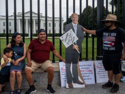 A carboard cutout of US President Joe Biden is placed against a fence during a demonstration in front of the White House in Washington DC, on July 25, 2021. - Rallies are taking place around the world as Cuba endures its worst economic crisis in 30 years, with chronic shortages …