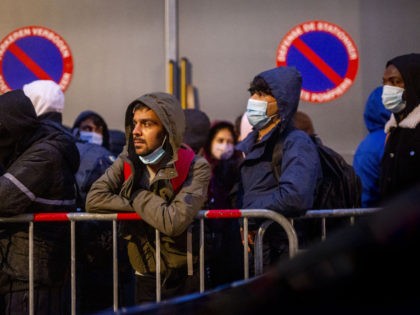Illustration shows the conditions of waiting outside for asylum seekers in front of the &#