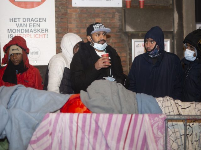Illustration shows the conditions of waiting outside for asylum seekers in front of the 'Klein Kasteeltje - Petit Chateau' (Little Castle) Fedasil registration center for asylum seekers in Brussels, Wednesday 01 December 2021. Several humanitarian organizations denounce the fact that people are sleeping in the streets due to a lack …