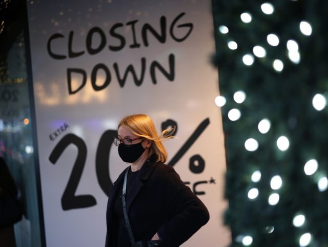 LONDON, ENGLAND - DECEMBER 21: Shoppers stand outside House of Fraser on Bond Street during the store's closing down sale on December 21, 2021 in London, England. UK Chancellor of the Exchequer Rishi Sunak announced a £1 billion fund for businesses hurt by the surge of Covid-19 cases, including hospitality …