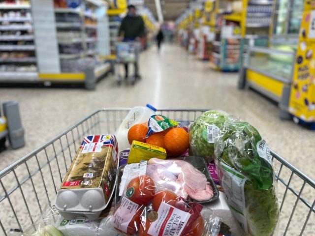 A customer shops for food items inside a Tesco supermarket store in east London on January