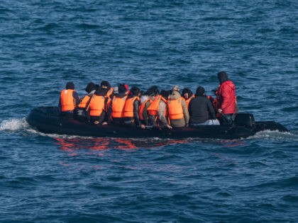 Migrants wearing life jackets sit in a dinghy as they illegally cross the English Channel from France to Britain on March 15, 2022. (Photo by Sameer Al-DOUMY / AFP) (Photo by SAMEER AL-DOUMY/AFP via Getty Images)