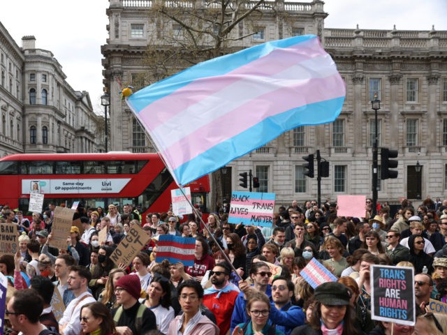 LONDON, ENGLAND - APRIL 10: Demonstrators hold placards during the No Ban Without Trans pr
