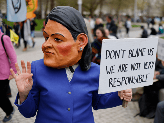 An activist from the climate change protest group Extinction Rebellion (XR), dressed up as