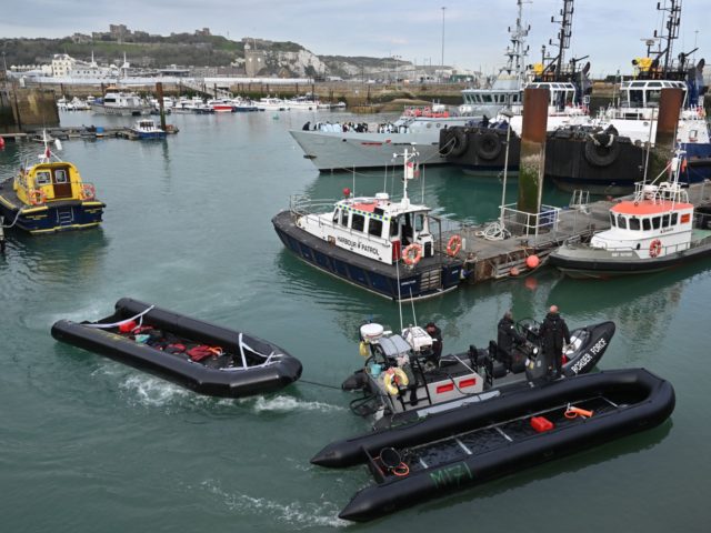 Inflatable dinghies, used by migrants to cross the English Channel are brought to port by