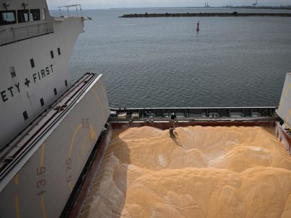 Workers takes corn samples from a loaded ship at Pier 80 in the Black Sea port of Constanta, Romania on May 3, 2022. - The Romanian port seeks to become an export hub for neighbouring Ukraine after Russia's invasion cut off its sea routes. Before the war, Ukraine exported 4.5 …