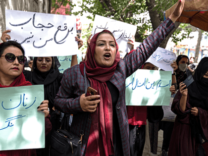 Members of Afghanistan's Powerful Women Movement, take part in a protest in Kabul on May 10, 2022. - About a dozen women chanting "burqa is not my hijab" protested in the Afghan capital on May 10 against the Taliban's order for women to cover fully in public, including their faces. …