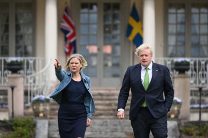 Sweden's Prime Minister Magdalena Andersson shows the way to British Prime Minister Boris Johnson as he arrives for talks at the retreat residence of the Swedish Prime Minister in Harpsund 120km west of Stockholm, Sweden on May 11, 2022. (Photo by Jonathan NACKSTRAND / AFP) (Photo by JONATHAN NACKSTRAND/AFP via …