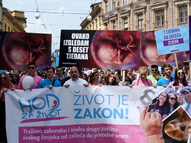 Protestors take part in the "March for Life", the Croatia's seventh annual anti-abortion march organized by conservative associations, in Zagreb on May 14, 2022. - Thousands of anti-abortion demonstrators took to the streets on May 14, 2022, in Croatia, a largely Catholic country where human rights activists say reproductive rights …