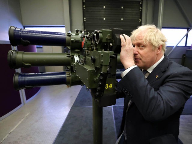 BELFAST, NORTHERN IRELAND - MAY 16: Prime Minister Boris Johnson with a Mark 3 shoulder launch LML (Lightweight Multiple Launcher) missile system at Thales weapons manufacturer during a visit to Northern Ireland for talks with Stormont parties on May 16, 2022 in Belfast, Northern Ireland. The British prime minister visited …