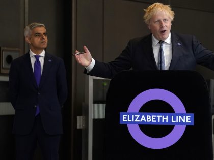 LONDON, ENGLAND - MAY 17: Mayor of London Sadiq Khan watches as British Prime Minister Boris Johnson holds a speech to mark the completion of London's Crossrail project at Paddington Station on May 17, 2022 in London, England. (Photo by Andrew Matthews - WPA Pool/Getty Images)