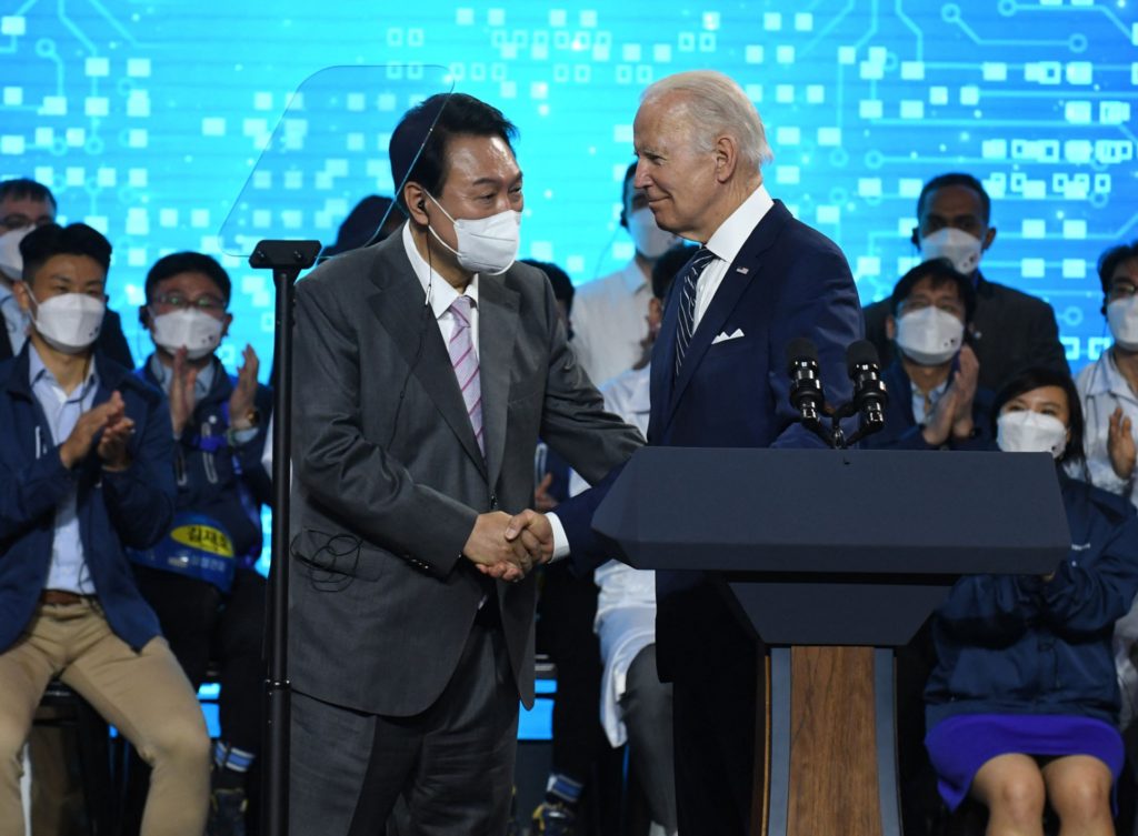 US President Joe Biden (R) shakes hand with South Kroean President Yoon Suk-youl after a press conference at the Samsung Electronic Pyeongtaek Campus in Pyeongtaek on May 20, 2022. (Photo by KIM Min-Hee / POOL / AFP) (Photo by KIM MIN-HEE/POOL/AFP via Getty Images)