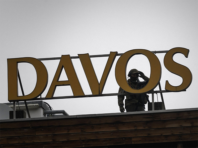 A speciale police officer is seen on the roof of the Congress hotel during a session at the World Economic Forum (WEF) annual meeting in Davos on May 24, 2022. (Photo by Fabrice COFFRINI / AFP) (Photo by FABRICE COFFRINI/AFP via Getty Images)