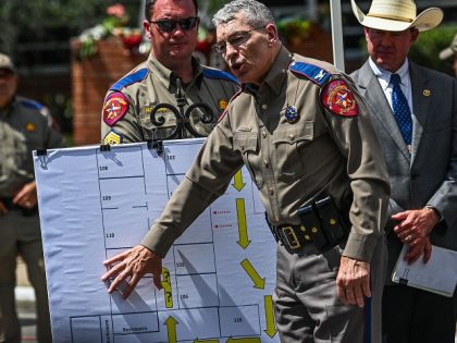 Director and Colonel of the Texas Department of Public Safety Steven C. McCraw speaks at a press conference using a crime scene outline of the Robb Elementary School showing the path of the gunman, outside the school in Uvalde, Texas, on May 27, 2022. - McCraw said Friday that in …