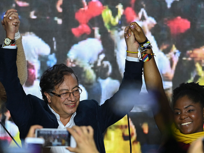 Colombian presidential candidate for the Historic Pact coalition Gustavo Petro (L) and his running mate Francia Marquez (R), celebrate at the party headquarters, in Bogota on May 29, 2022. - Following the official results Petro will face a 77-year-old populist outsider Rodolfo Hernandez in a runoff election next June 19. …