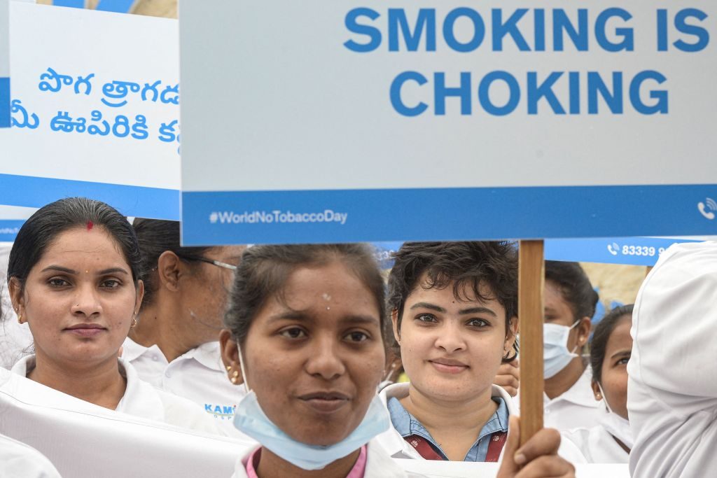 Medical students and staff from a hospital display placards during an awareness rally against the use of tobacco on World No Tobacco Day in Hyderabad on May 31, 2022. (Photo by NOAH SEELAM / AFP) (Photo by NOAH SEELAM/AFP via Getty Images)