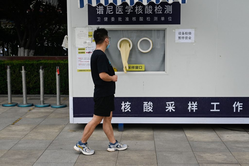 A man walks past a closed swab testing site in Beijing on May 31, 2022. (Photo by WANG Zhao / AFP) (Photo by WANG ZHAO/AFP via Getty Images)
