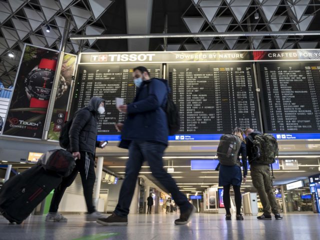 FRANKFURT AM MAIN, GERMANY - JANUARY 28: Passengers pictured in the Terminal 1 of the Frankfurt Airport on January 28, 2021 in Frankfurt, Germany. Border police check passengers arriving from Covid-19 risk countries to be sure they can show evidence of a recent COVID-19 test at Frankfurt Airport during the …