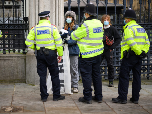 LONDON, ENGLAND - FEBRUARY 10: Protestors demonstrating against student fees are stopped o