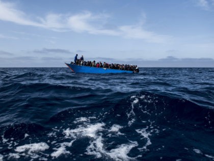 AT SEA - MARCH 29: A wooden boat with 95 migrants on board waits to be rescued by the NGO Open Arms on March 29, 2021 in At Sea, Unspecified. The Spanish NGO Open Arms rescued passengers in two wooden boats, with 84 and 97 people respectively. The Open Arms …