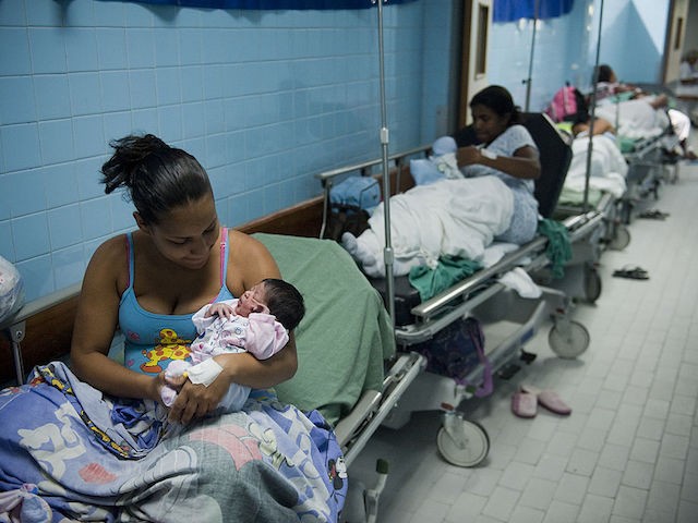 TO GO WITH AFP STORY BY LISSY DE ABREU Mothers and their newborns rest in a maternity center in Caracas, on December 15, 2011. According to the World Health Organization, Venezuela holds the first place in South America in cases of early pregnancy, with about 1,500 children born daily from teenage mothers aged between 12 and 19 years. AFP PHOTO / Leo RAMIREZ (Photo credit should read LEO RAMIREZ/AFP via Getty Images)