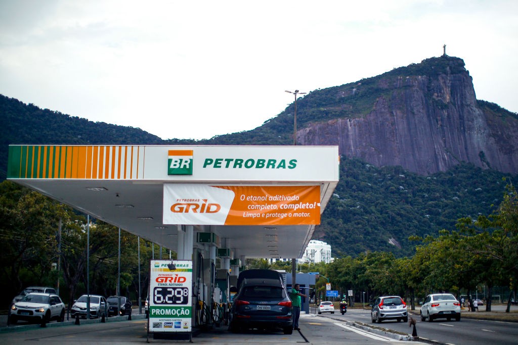 RIO DE JANEIRO, BRAZIL - MARCH 12: A gas station near the statue of Christ the Redeemer at south zone of the city on March 12, 2022 in Rio de Janeiro, Brazil. Brazilian state-run oil company Petrobras announced fuel price increases due to the Russia-Ukraine conflict which has spiked global crude prices.  (Photo by Buda Mendes/Getty Images)
