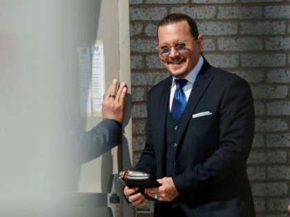 Johnny Depp steps outside court during his civil trial at Fairfax County Circuit Court on April 25, 2022 in Fairfax, Virginia. Depp is seeking $50 million in alleged damages to his career over an op-ed Heard wrote in the Washington Post in 2018. (Photo by Paul Morigi/Getty Images)