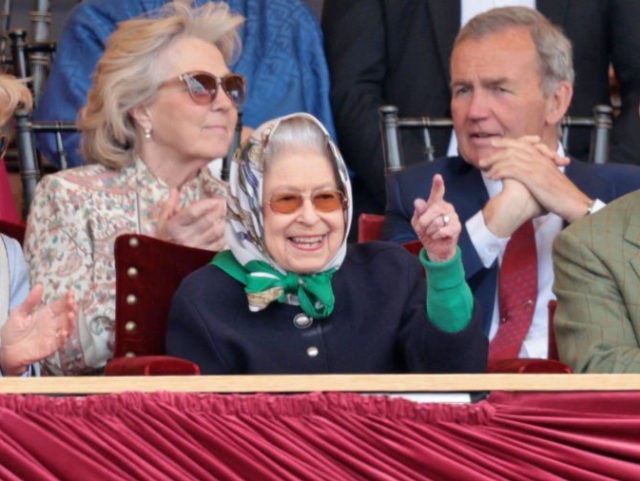 WINDSOR, ENGLAND - MAY 13: Penelope Knatchbull, Countess Mountbatten of Burma, Queen Elizabeth II and Prince Edward, Earl of Wessex celebrate the win at The Royal Windsor Horse Show at Home Park on May 13, 2022 in Windsor, England. The Royal Windsor Horse Show, which is said to be the …