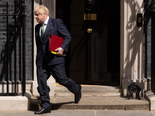 LONDON, ENGLAND - MAY 18: British Prime Minister Boris Johnson leaves 10 Downing Street to attend the weekly Prime Ministers Questions in the House of Commons on May 18, 2022 in London, England. (Photo by Dan Kitwood/Getty Images)