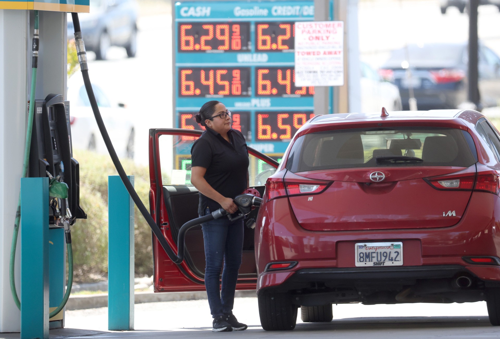 PETALUMA, CALIFORNIA - MAY 18: A customer pumps gas into their car at a gas station on May 18, 2022 in Petaluma, California. Gas prices in California have surpassed $6.00 per gallon for the first time ever. The average price per gallon of regular unleaded gasoline in California is at $6.05 and $6.29 in the San Francisco Bay Area. (Photo by Justin Sullivan/Getty Images)