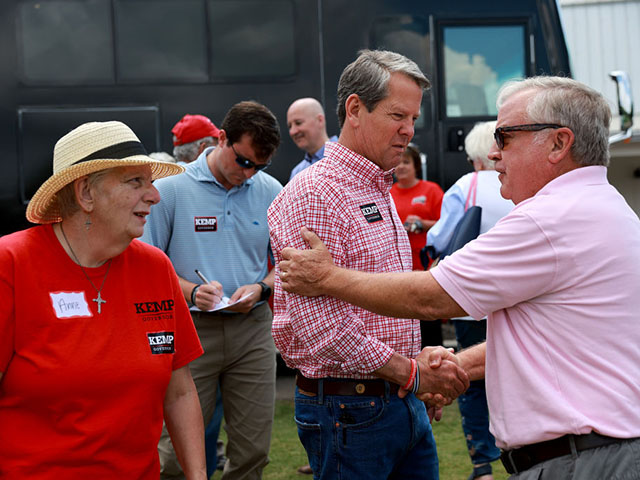 WATKINSVILLE, GEORGIA - MAY 21: Georgia Gov. Brian Kemp greets people as he campaigns during a Get Out the Vote cookout at the Hadden Estate at DGD Farms on May 21, 2022 in Watkinsville, Georgia. Gov. Kemp is facing off against David Perdue in the Georgia Republican gubernatorial primary. (Photo by Joe Raedle/Getty Images)